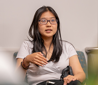 Female Fulbright student sitting in chair